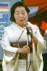 woman giving a speech at the intl tea ceremony.jpg